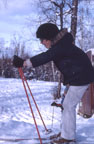 Peter showing off for Barbara in the side driveway - note Sam behind his legs