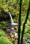 Look for the undercut behind the waterfall with Sam on the right